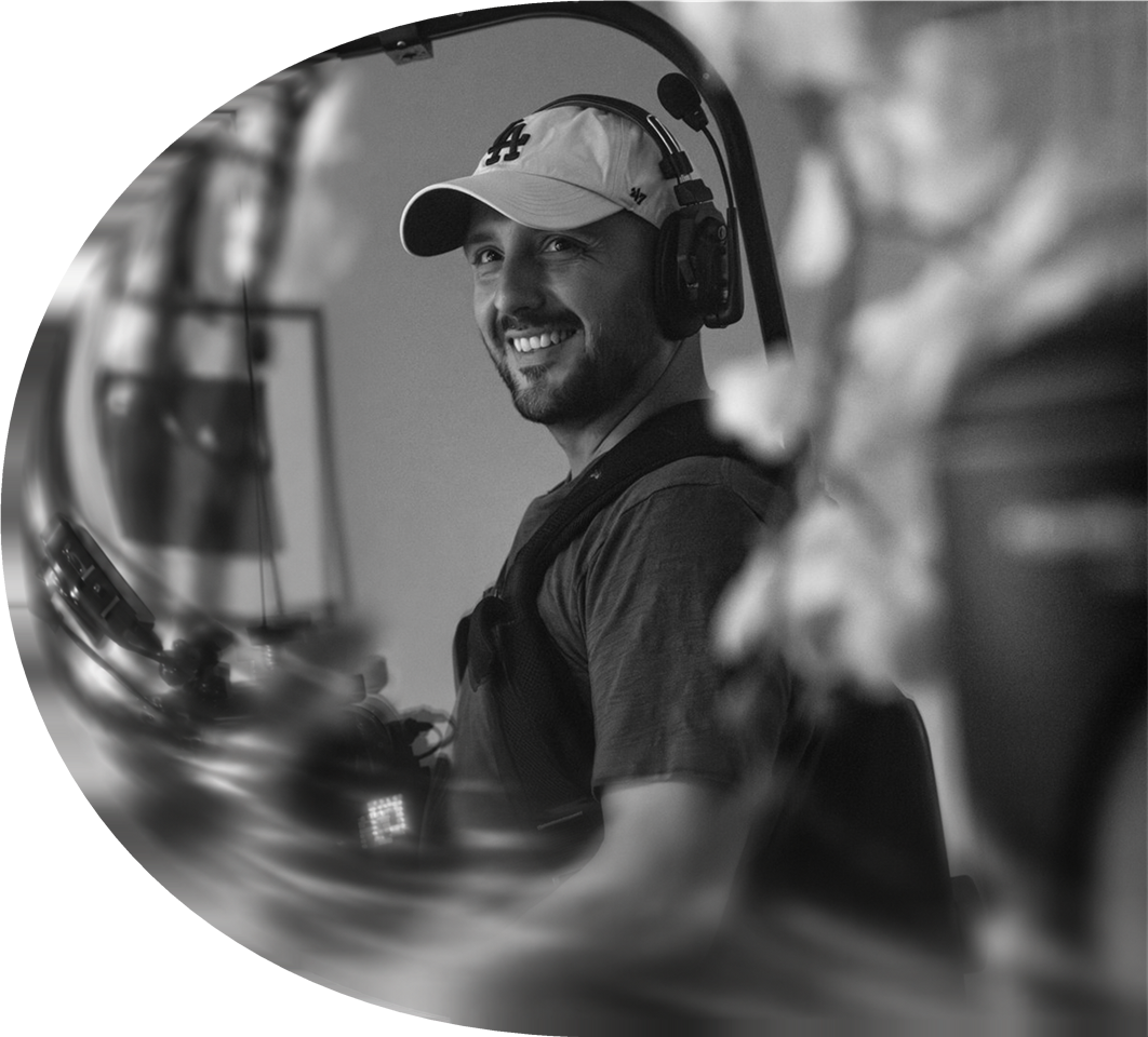 Gabriel LN on set, smiling beside a camera rig