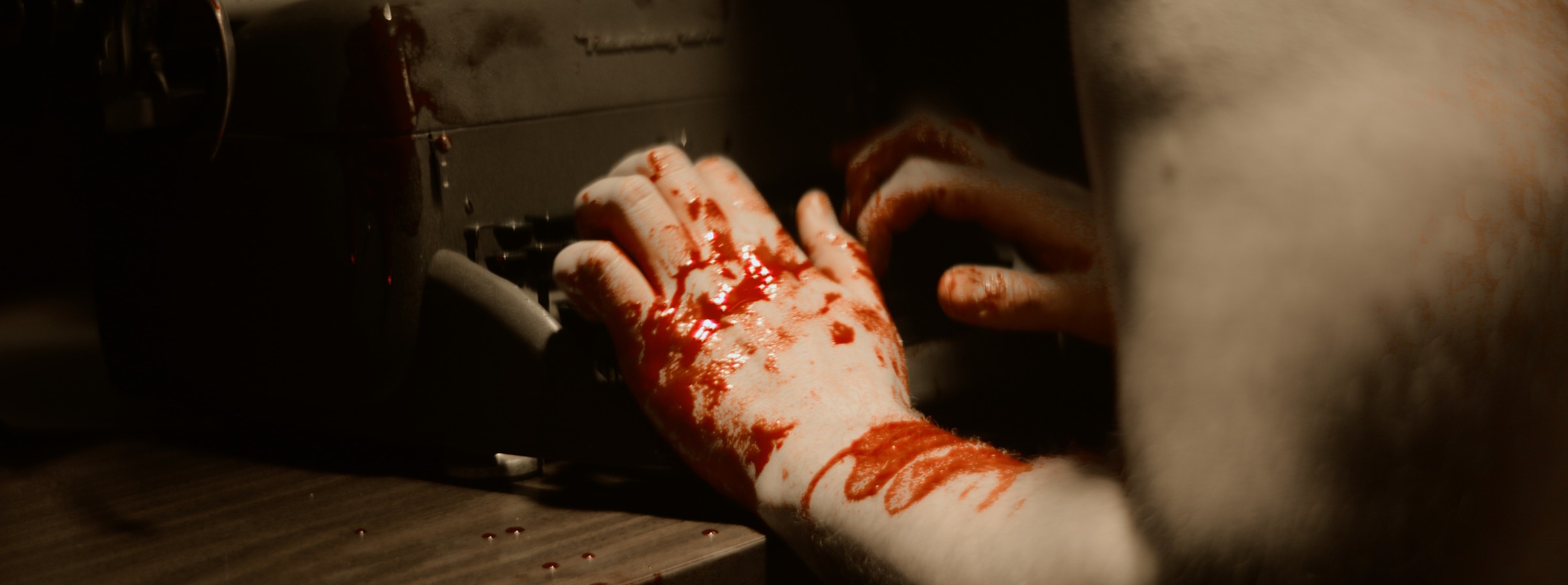 Close-up of bloodied hands on a table — Markings of Murder