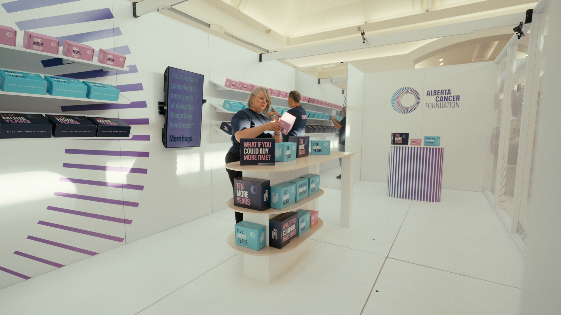 Colorful boxes line shelves inside a bright retail installation — Time Store