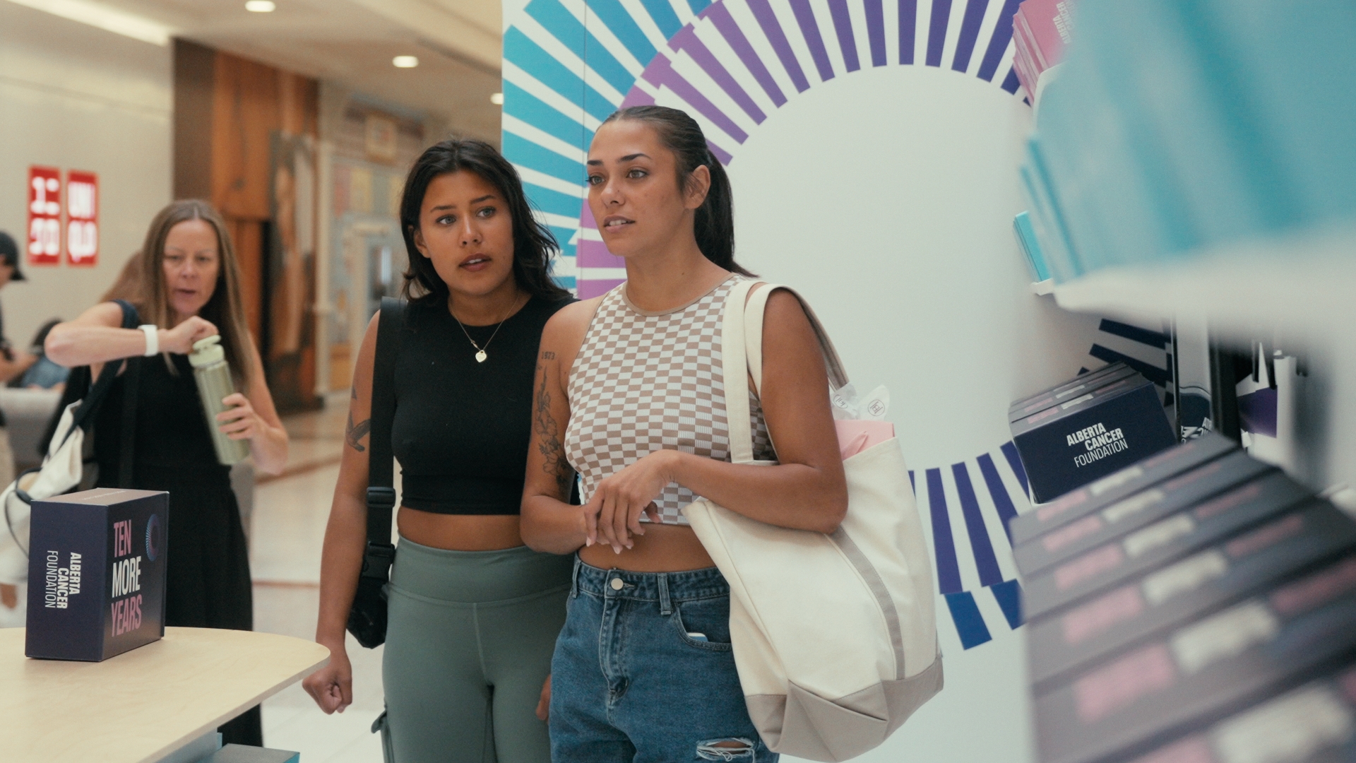 Visitors browse colorful boxes inside the installation — Time Store