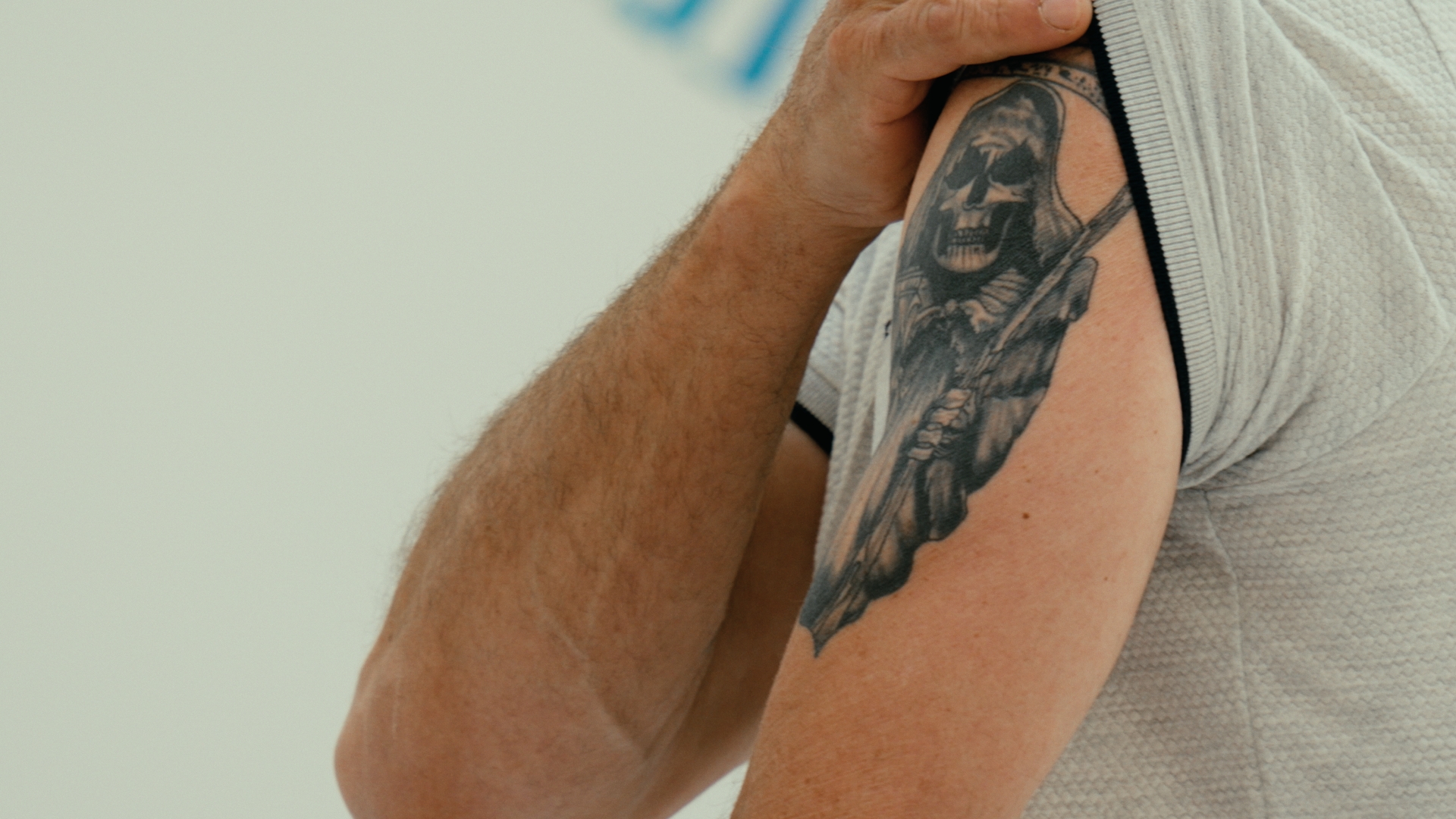 Close-up of a tattoo on a man’s upper arm — Time Store